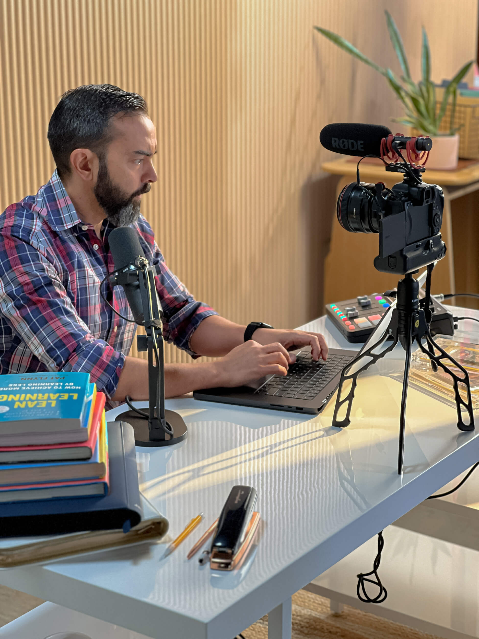 Pat filming a YouTube video with a camera on a Switchpod tripod