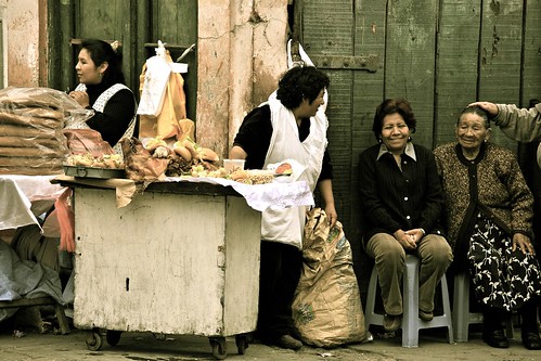 Sharing A Laugh Image of a street vendor selling food
