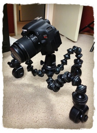 Cineskates Picture of camera mounted to three bendy legs on wheels