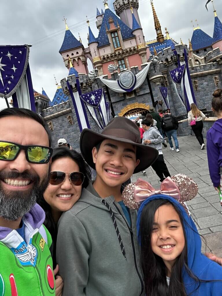 Pat with wife and kids at an amusement park