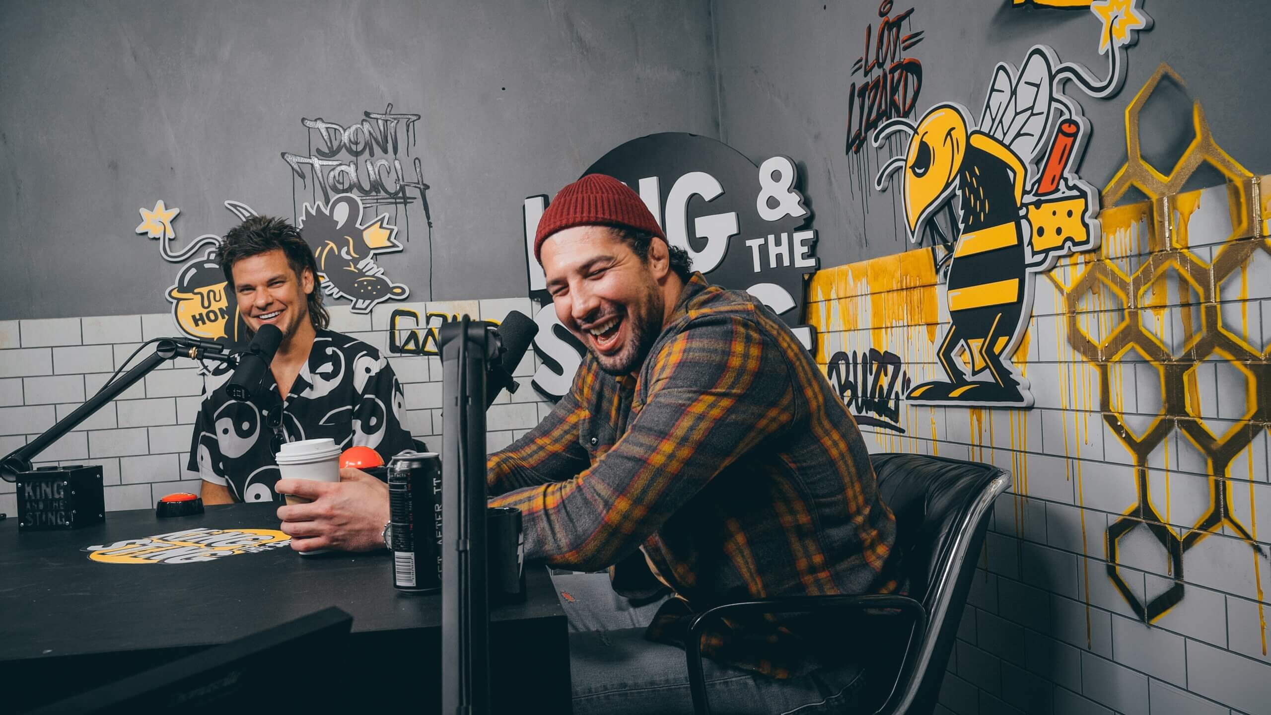 Picture of two guys laughing while podcasting