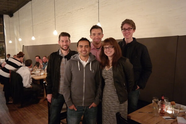 Five people posing in a restaurant. From left to right: Steve (Android developer), Myself, Matt (Executive Producer), Mindy (Assistant Producer), Dustin (UX / UI / Design).