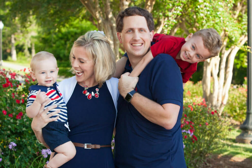 Brent Lacey outside with wife and two small boys